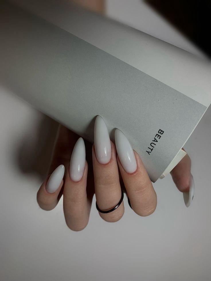 White ombre almond nails manicure, elegant long nail design trend 2025 for modern women.